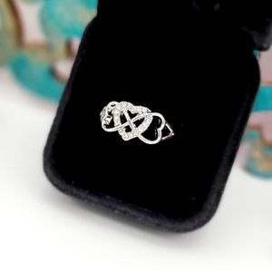 Sterling Silver Entwined, linked hearts and inlaid zircon ring. Multiple sizes